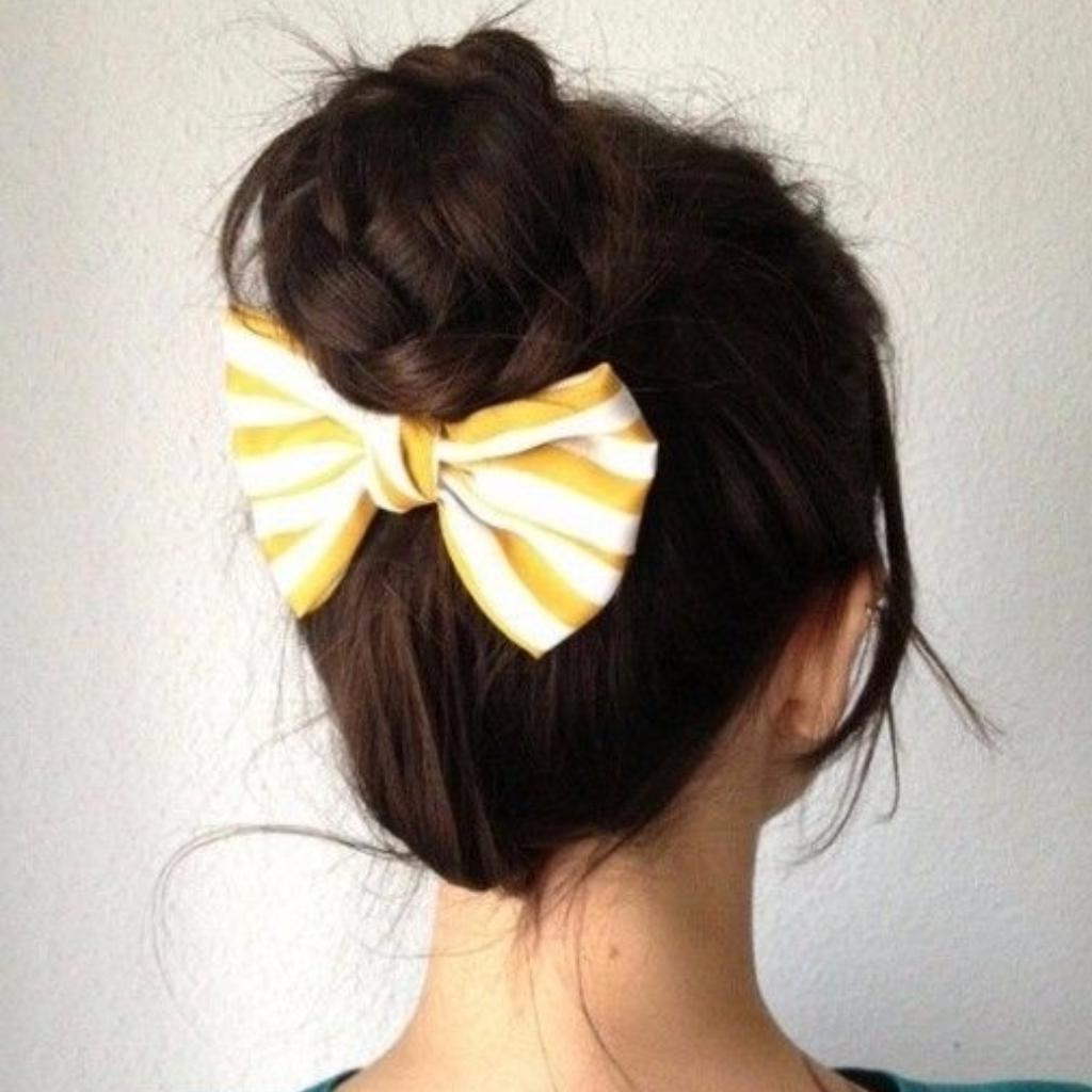 chignon alto peluquería Escándalo